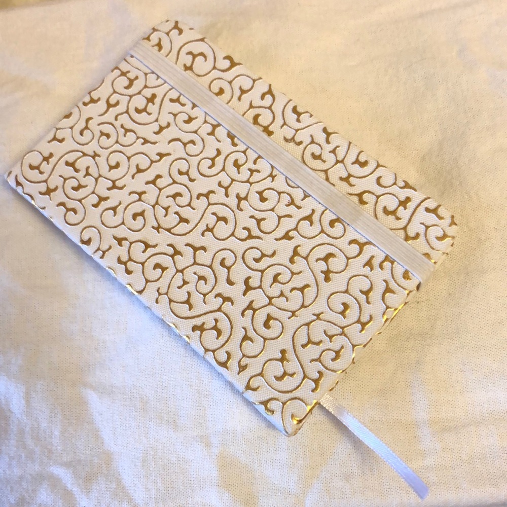 Small unused white notebook